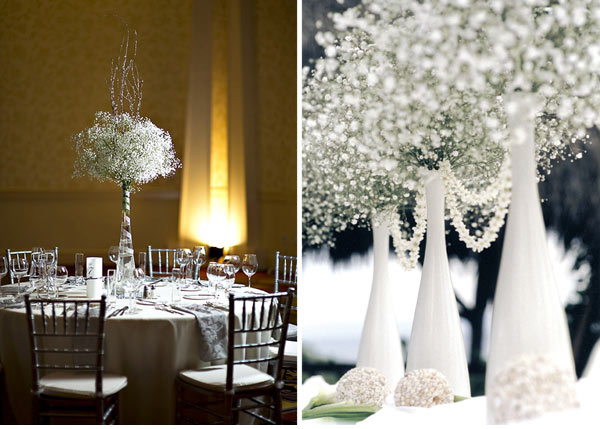 very tall white vase with baby's breath shaped in a topiary ball